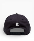 Navy cap with a logo on the back against a white background
