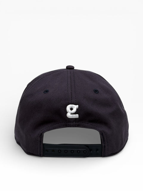 Navy cap with a logo on the back against a white background